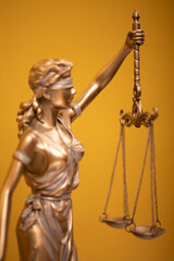 Themis and gavel in court library