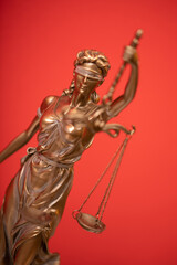 Fototapeta premium Bronze statue of the Goddess of Justice Themis, holding the Law Scales in her hands,