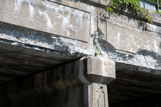 A badly damaged concrete road overpass