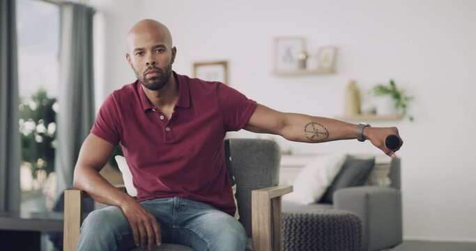 Black man, microphone and portrait in chair, living room and speech for speaking, home and drop mic. Confident, speaker and apartment with face, hosting and presenter for practice, host and house