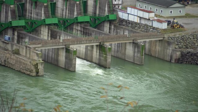 Draining water from sluice of hydroelectric power station is located at mouth of river between mountains. Ajara Energy water power plant in Georgia. Green energy, environmental protection, ecology