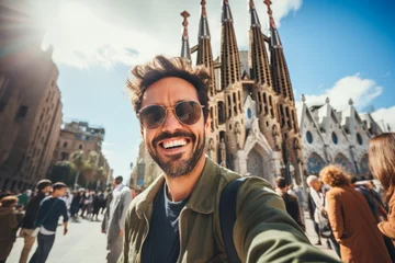 Fotobehang Man Capturing a Memorable Selfie in Front of a Majestic Cathedral La Sagrada Familia in Barcelona, Spain © MiraCle72