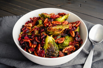Brussels Sprouts with Bacon, Pecans, and Cranberries: Vegetable side dish made with baby cabbages,...