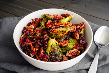 Brussels Sprouts with Bacon, Pecans, and Cranberries: Vegetable side dish made with baby cabbages, toasted pecan halves, and dried cranberries