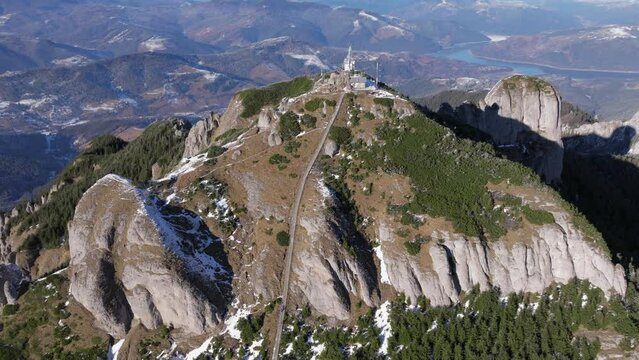 Aerial drone view of Toaca Peak in winter season. Ceahlatu Massif National Park, Romania