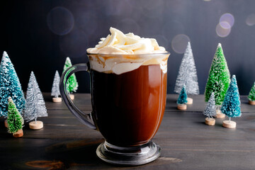 Spiced Christmas Coffee Topped with Whipped Cream: Large glass mug of freshly brewed spiced coffee...