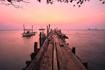 sunset on the pier in ko chang, thailand - obrazy, fototapety, plakaty