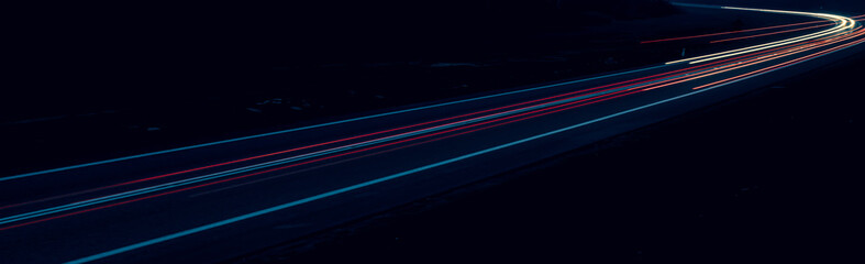 lights of cars driving at night. long exposure