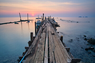 wooden pier at sunset in ko chang, thailand - obrazy, fototapety, plakaty