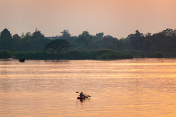 Kayaking at sunset,in the 4000 Islands region, on the Mekong River,Don Det,southern Laos.Southeast Asia.