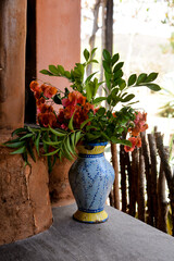 flowers in a vase, flowers in pots, colorful vase with flowers, rustic decoration, country house, farm hotel
