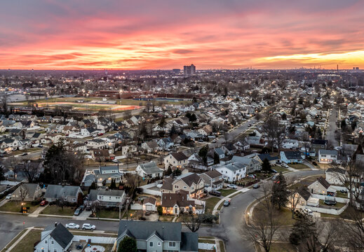 Long Island Aerial shot Nassau County at Sunset pink sky clouds