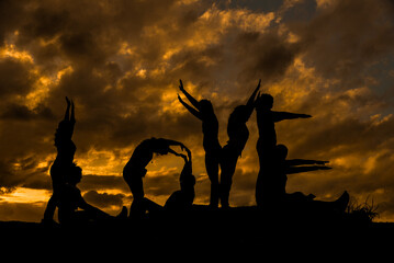 silhouette of a persons,silhouettes of people in the sunset,peoples at sunset,silhouette of people,group of people at sunset,group of people,word love with people doing, sunset on the mountain