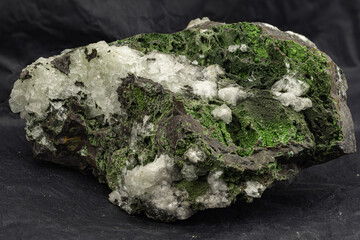 Detailed Macro View of Epidote Mineral Collection Piece Against Dark Backdrop