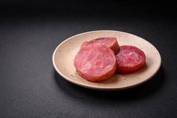 Round shape steaks of raw juicy tuna with salt and spices