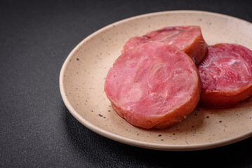 Round shape steaks of raw juicy tuna with salt and spices