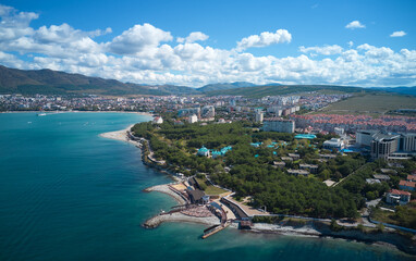 Fototapeta premium Panoramic aerial view of Gelendzhik Bay with infrastructure and urban architecture. Shooting from a drone. Copy space.