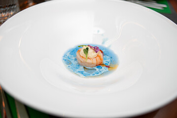 seafood dish in a white restaurant. gourmet dish of seafood