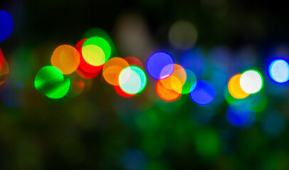 Blurred holiday lights. Out of focus. Night photography. Moment of celebration.