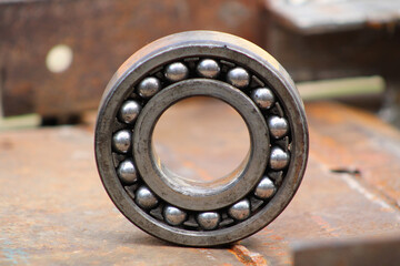 Close-up of a worn open-type bearing