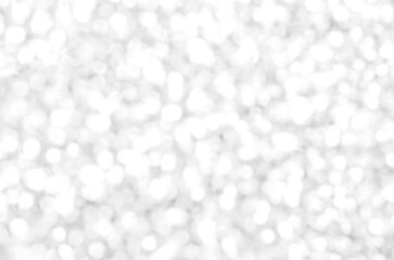 White and gray bokeh background. Photo can be used for the concepts of New Year, Christmas, Wedding Anniversary and all celebrations.