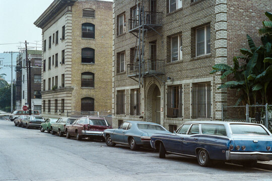 Grainy 1980s film photo of brick apartment buildings on Ingraham Street near downtown Los Angeles, California.  Shot June, 1985.