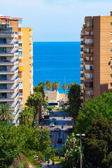 Alboran (Mediterranean) sea seen between apartment buildings in Malaga.