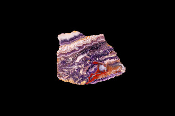 purple fluorite, red agate and chalcedony slice photography. macro detail black isolated background. close-up polished semi-precious gemstone copy space.