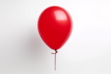Minimalist appeal Vivid red balloon isolated on a pristine white background, a simple yet captivating image.