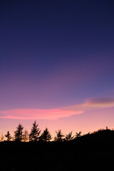 A wonderful sky during dusk in Piemonte. Govone, Italy - December 22, 2023.