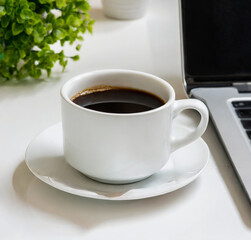 Obraz na płótnie Canvas cup of coffee on desk in office, modern lifestyle