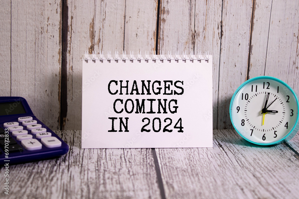 Poster white notepad with text changes coming in 2024 and office tools on the blue background.
