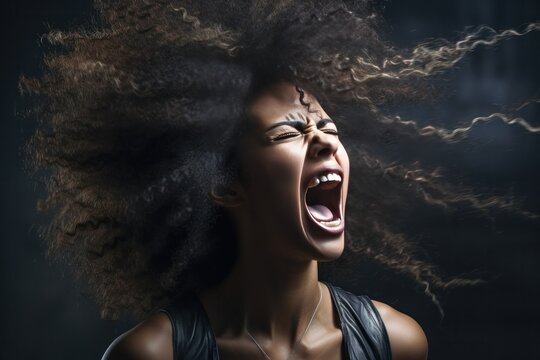 An Angry African American Young Woman Yelling To The Camera. Angry And Distressed Looking. Hair Is Messy.