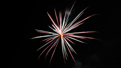 Fourth of july red and white fireworks exploding in the black sky for usa celebration