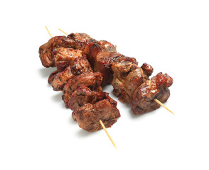 Wooden skewers with delicious shish kebabs isolated on white