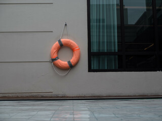 lifebuoy round circle orange color swimming pool river sea ocean staircase beach buoy rescue summer...