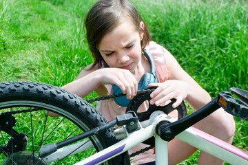 Young girl cyclist enjoy the beautiful sunrise on summer forest trail