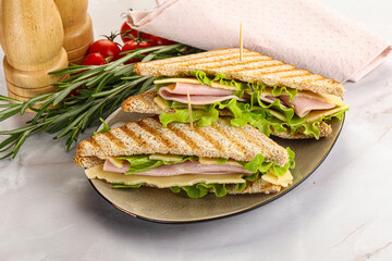 Homemade club sandwich with ham and cheese