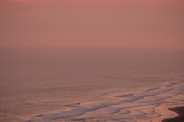 blurred image of aerial view of the beach at dusk. twilight sky.