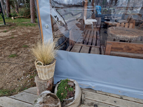 front gardens of well-occupied restaurants in summer are emptied during the winter. solution is to cover pergola with a transparent tailor made foil. can be heated by gas burner. corner, install