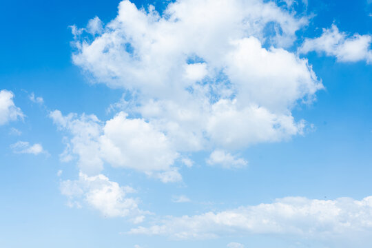 Blue Sky Light Ray background and fluffy white large cloud