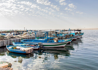 Fototapeta na wymiar A Fishing Port with Small Fishing Boats in Southern Medenine, Tunisia