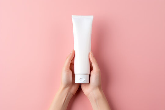 White empty facewash bottle in women hand