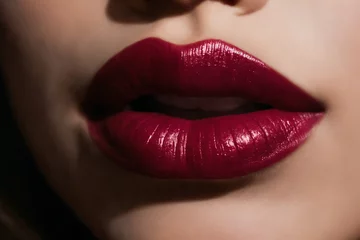 Close-up of beautiful lips with bordeaux lipstick © Giuseppe Cammino