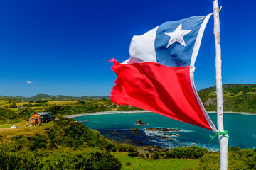 A view from Islotes de Punihuil with Chilean flag seen in foreground