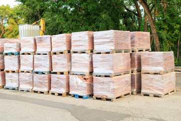 Pallets with paving slabs. Background with selective focus and copy space