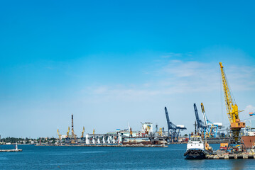 Fototapeta premium Harbor Filled With Boats Under a Clear Blue Sky. A harbor filled with lots of boats under a blue sky