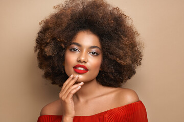 Beauty portrait of African American girl with afro hair. Beautiful black woman. Cosmetics, makeup...