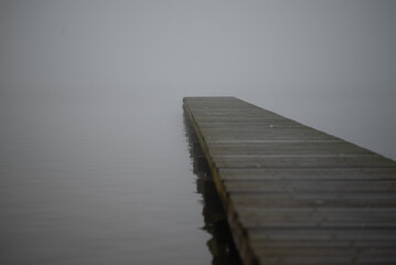 View from a pier during a foggy morning.