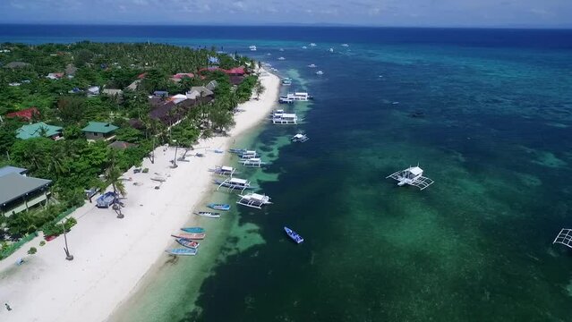 Bounty Beaches and Malapascua Island Seashore in Cebu, Philippines. Sulu Sea, Boats and Beautiful Seascape in Background. Drone